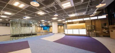 Second floor of FlyStation Japan featuring the upper flight chamber, glass floor, cafe, and merchandise area.