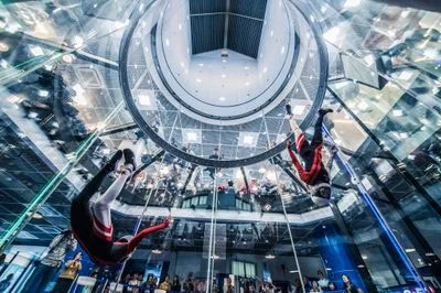 Dynamic flyers competing in the TT45 Pro flight chamber at FlyStation Japan.