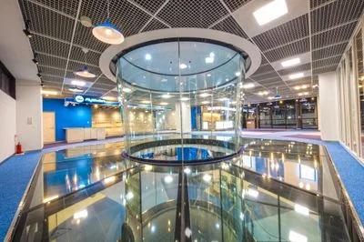 Upper level view of TT45 PRO flight chamber and glass floor at FlyStation Japan