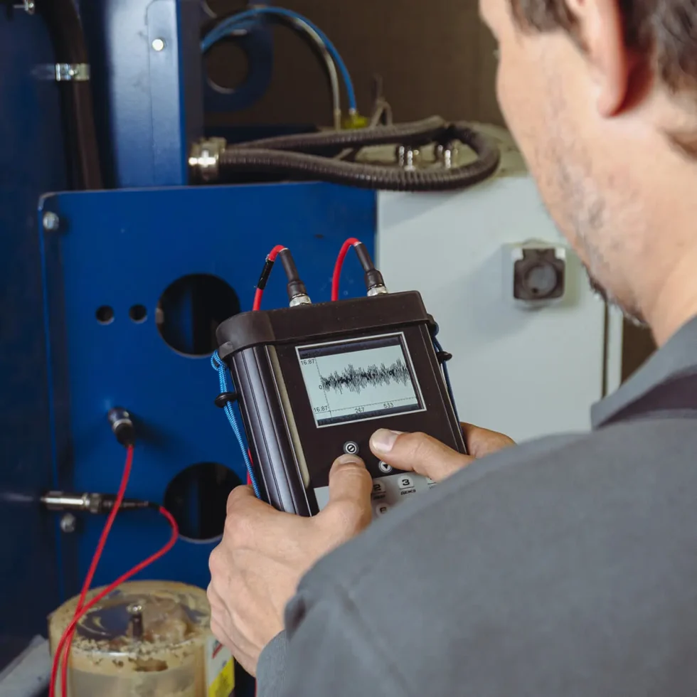 Engineer performing Wind Tunnel Maintenance and Vibration Check